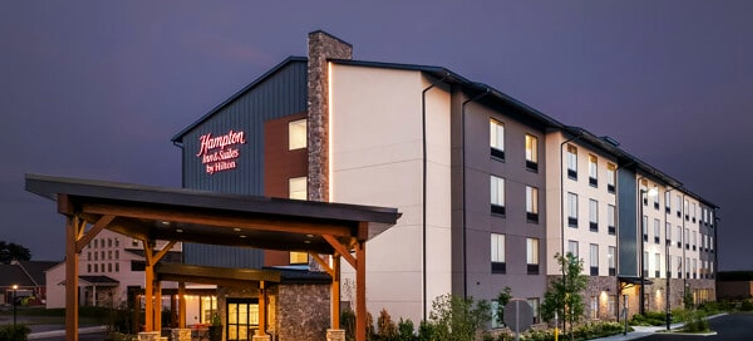 Hampton Inn & Suites by Hilton in Intercourse, Pennsylvania, illuminated at dusk